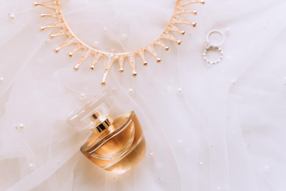 flatlay-of-bridal-details-on-wedding-day-perfume-e-2024-10-14-11-02-26-utc.jpg